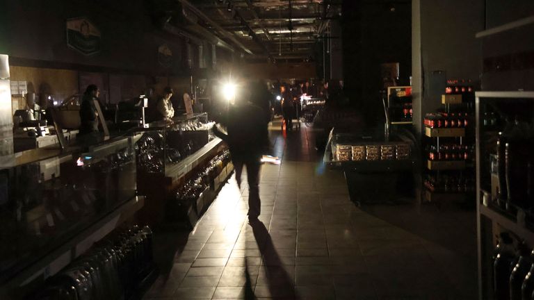 A supermarket in Kyiv during a power outage. Pic: AP