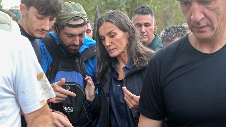 Spain's Queen Letizia speaks with people affected by the floods. Pic: AP