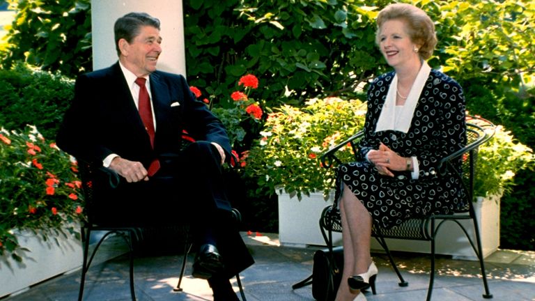 President Ronald Reagan and British Prime Minister Margaret Thatcher speak outside the White House oval office on July 17, 1987 (AP Photo/Scott Apple White)