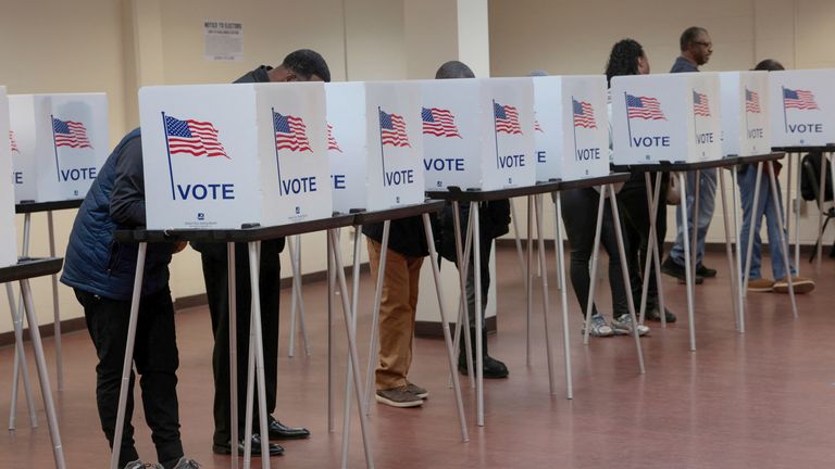 Voters cast their votes during early voting in the U.S. presidential election at a polling station in Detroit, Michigan.
Pic: Reuters