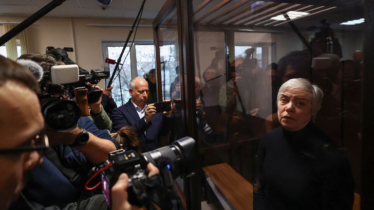 Nadezhda Buyanova stands inside an enclosure for defendants during a court hearing in Moscow on 12 November. Pic: Reuters