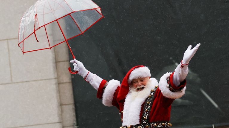 A man dressed as Santa Claus gestures during the 98th Macy's Thanksgiving Day Parade in New York City, U.S., November 28, 2024. REUTERS/Eduardo Munoz

