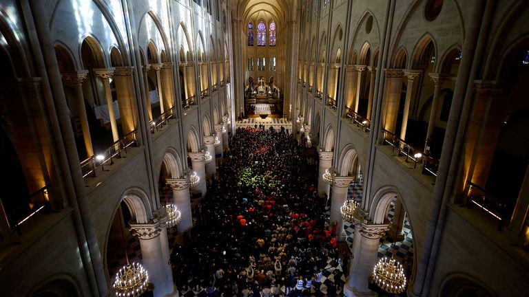 French President Emmanuel Macron delivers a speech to construction workers inside the Notre-Dame de Paris cathedral after visiting the restored interiors of the monument, Friday, Nov. 29, 2024 in Paris. (Sarah Meyssonnier/Pool via AP)