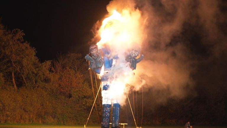 The effigy of the brothers Ticketmaster and Oasis burns