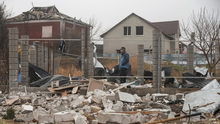 Residents stand next to their houses damaged by a Russian missile strike, amid Russia's attack on Ukraine, on the outskirts of Odesa, Ukraine November 28, 2024. REUTERS/Nina Liashonok