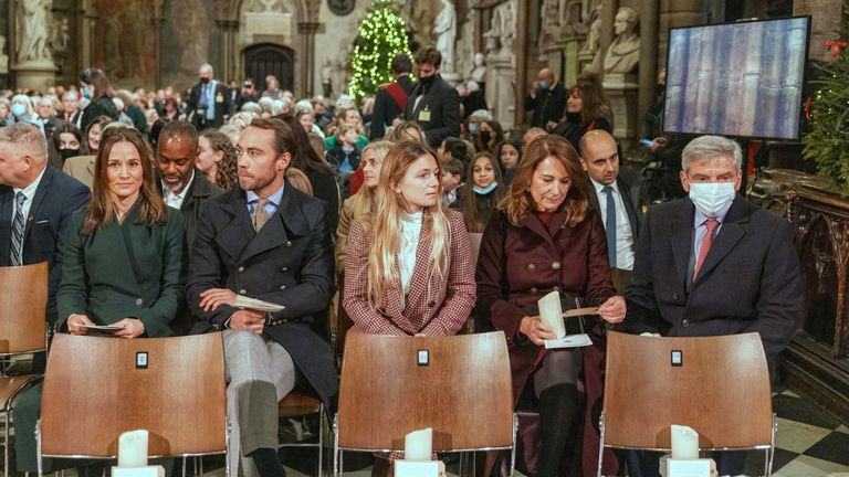 EMBARGOED TO 0001 WEDNESDAY NOVEMBER 13 File photo dated 8/12/2021 of the Duchess of Cambridge's family, inlcuding her parents, Michael (right) and Carole (second right), and her sister and brother, Pippa Matthews and James Middleton (both left) take their seats ahead of the Together At Christmas community carol service at Westminster Abbey in London. The Princess of Wales will host her annual Christmas carol concert this year, with the service reflecting on "how much we need each other, especia