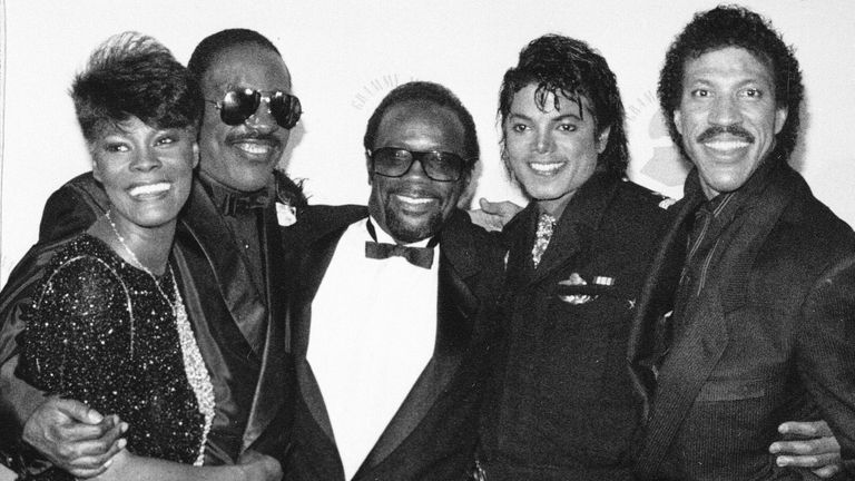 Grammy winners Dionne Warwick, Stevie Wonder, Quincy Jones, Michael Jackson and Lionel Richie pose together backstage during the Grammy Awards show in Los Angeles on February 26, 1986. (AP Photo)