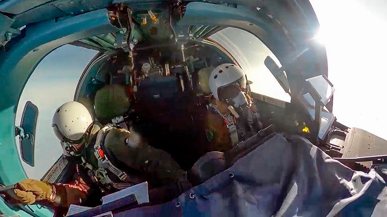 In this photo taken from video released by the Russian Defense Ministry on Thursday, Nov. 28, 2024, pilots of an Su-34 bomber of the Russian air force fly at an undisclosed location in Ukraine. (Russian Defense Ministry Press Service photo via AP)