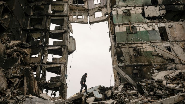 FILE - A resident looks for belongings in an apartment building destroyed during fighting between Ukrainian and Russian forces in Borodyanka, Ukraine, Tuesday, April 5, 2022. (AP Photo/Vadim Ghirda, File)