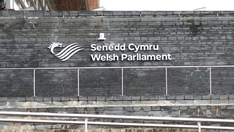 People cycle past The Senedd (Welsh parliament) building in Cardiff.
Pic: Reuters