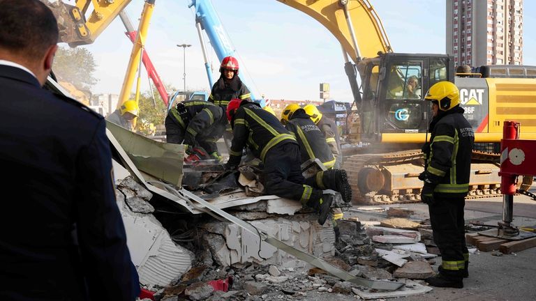 Rescuers on site. Photo: AP