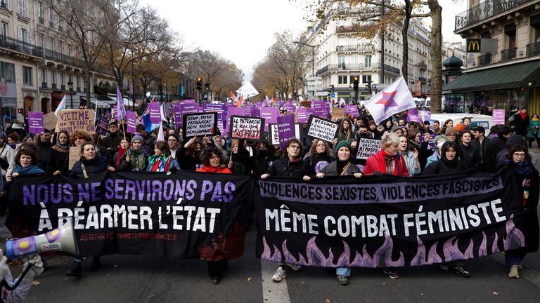 People take part in a demonstration to protest femicide, sexual violence and all forms of gender-based violence on the occasion of the International Day for the Elimination of Violence against Women on November 23, 2024 in Paris, France. The banners read: "We will not serve the rearmament of the state" And "Sexist violence, fascist violence, same feminist struggle". REUTERS/Abdul Saboor