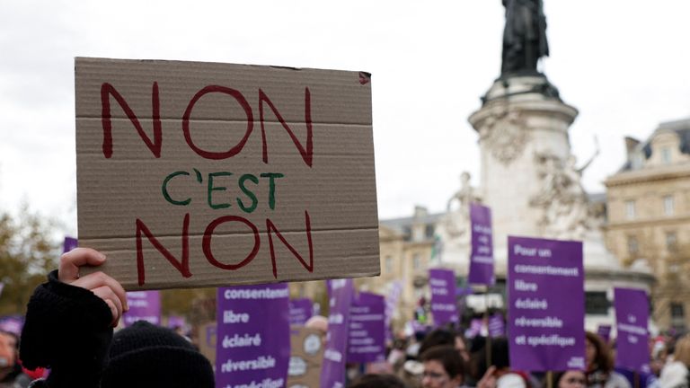 A person holds a banner while participating in a demonstration to protest femicide, sexual violence and all forms of gender-based violence on the occasion of the International Day for the Elimination of Violence against Women in Paris, France, November 23, 2024. The banner reads: "no no". REUTERS/Abdul Saboor