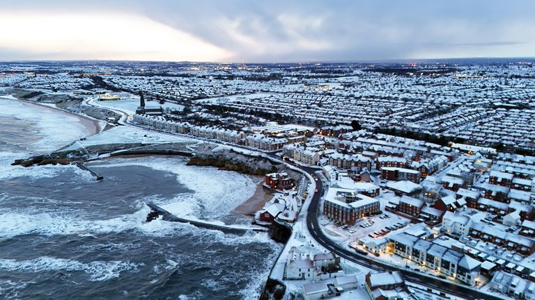 Overnight snow covers Cullercoats Bay in North Tyneside. There is widespread travel disruption after heavy snowfall and ice affected parts of the UK, with the Met Office advising vehicles could be stranded, power cuts may occur and rural areas could be cut off. Picture date: Wednesday November 20, 2024. PA Photo. Photo credit should read: Owen Humphreys/PA Wire