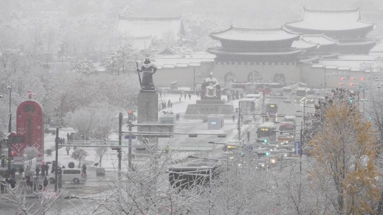 Gwanghwamun Square and Gyeongbok Palace are blanketed with snow in Seoul, South Korea. Pic: AP