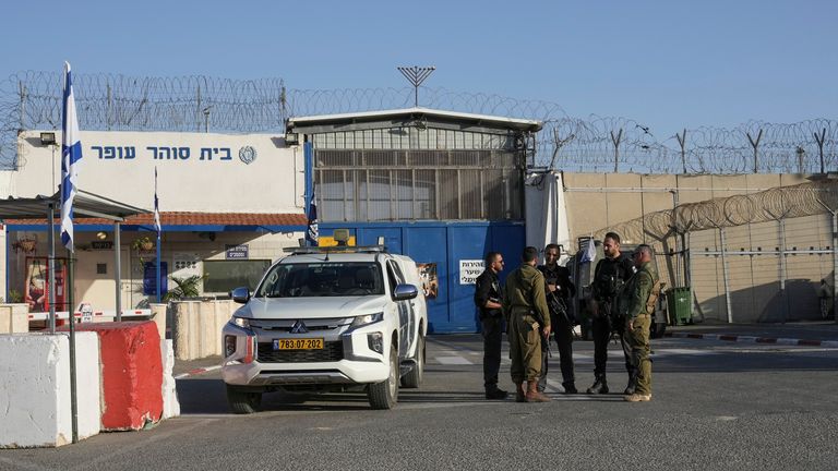 Israeli soldiers stand outside Ofer military prison near Jerusalem on Friday, Nov. 24, 2023. Friday marks the start of a four-day cease-fire in the Israel-Hamas war, during which the Gaza militants pledged to release 50 hostages in exchange for 150 Palestinians imprisoned by Israel. (AP Photo/Mahmoud Illean)