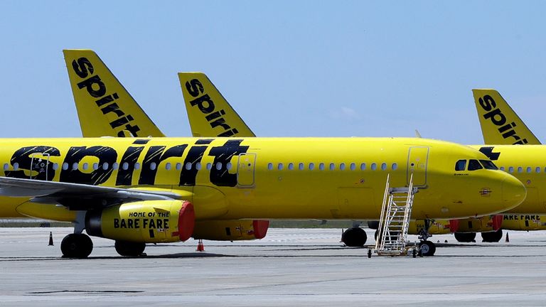 FILE - A line of Spirit Airlines jets sit on the tarmac at Orlando International Airport on May 20, 2020, in Orlando, Fla. (AP Photo/Chris O'Meara, File)