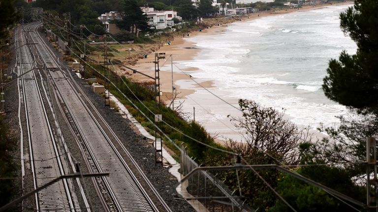 Empty train tracks and a beach, as Spain braces for a new DANA storm system, near Tarragona.
Pic: Reuters