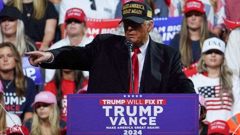 Republican presidential nominee and former U.S. President Donald Trump attends a rally at Atrium Health Amphitheater in Macon, Georgia U.S., November 3, 2024. REUTERS/Megan Varner