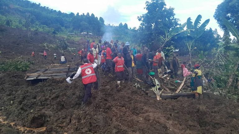 Members of the Uganda Red Cross Society help the search for bodies. Pic: Reuters