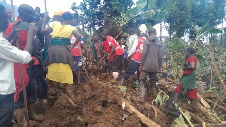 Members of the Uganda Red Cross Society help the search for bodies. Pic: Reuters