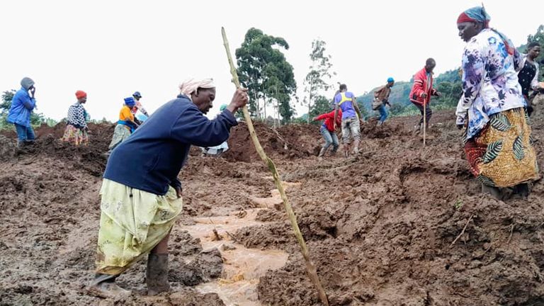 People search for bodies after the landslides in Bulambuli. Pic: Reuters