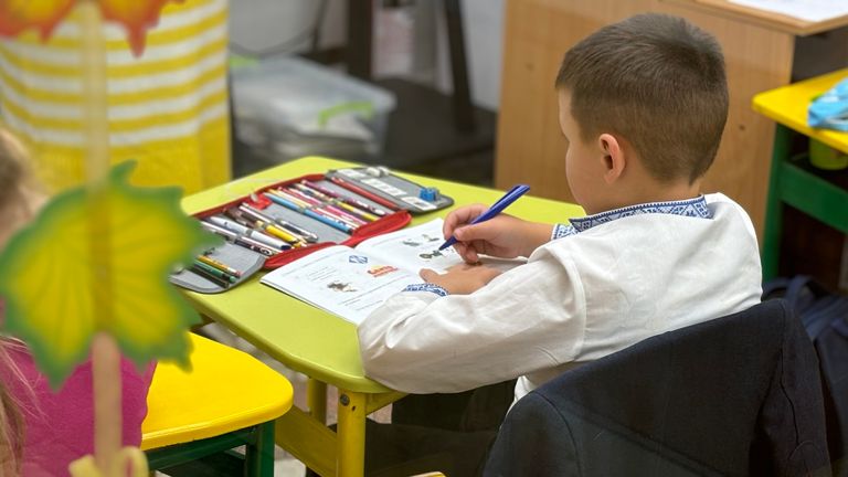 A young child at school in Kharkiv's underground system