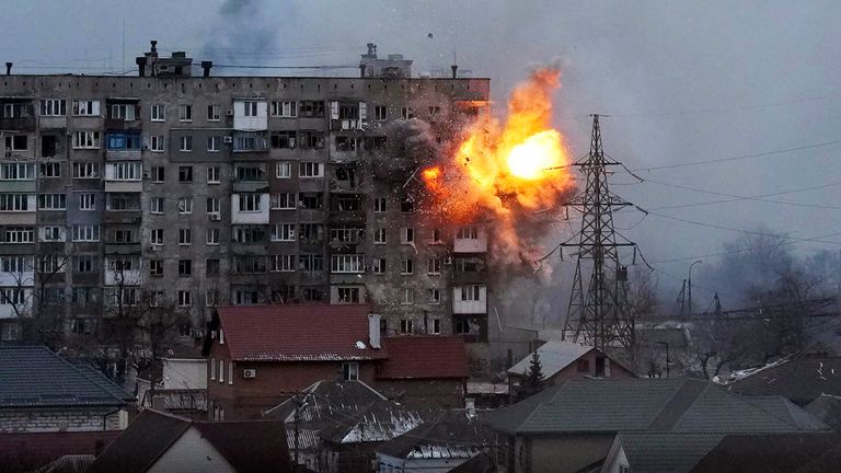 FILE - An explosion is seen in an apartment building after Russian's army tank fires in Mariupol, Ukraine, Friday, March 11, 2022. (AP Photo/Evgeniy Maloletka, File)