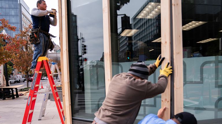 A pharmacy near the White House boarded up its windows on Monday. Image: Reuters