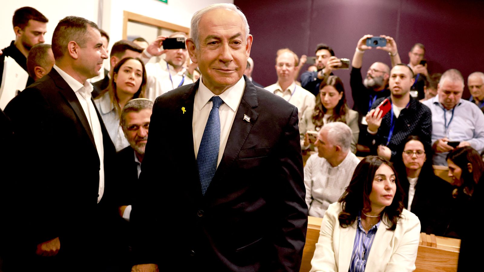 Benjamin Netanyahu gives evidence in fortified courtroom as he calls corruption claims 'absurd'