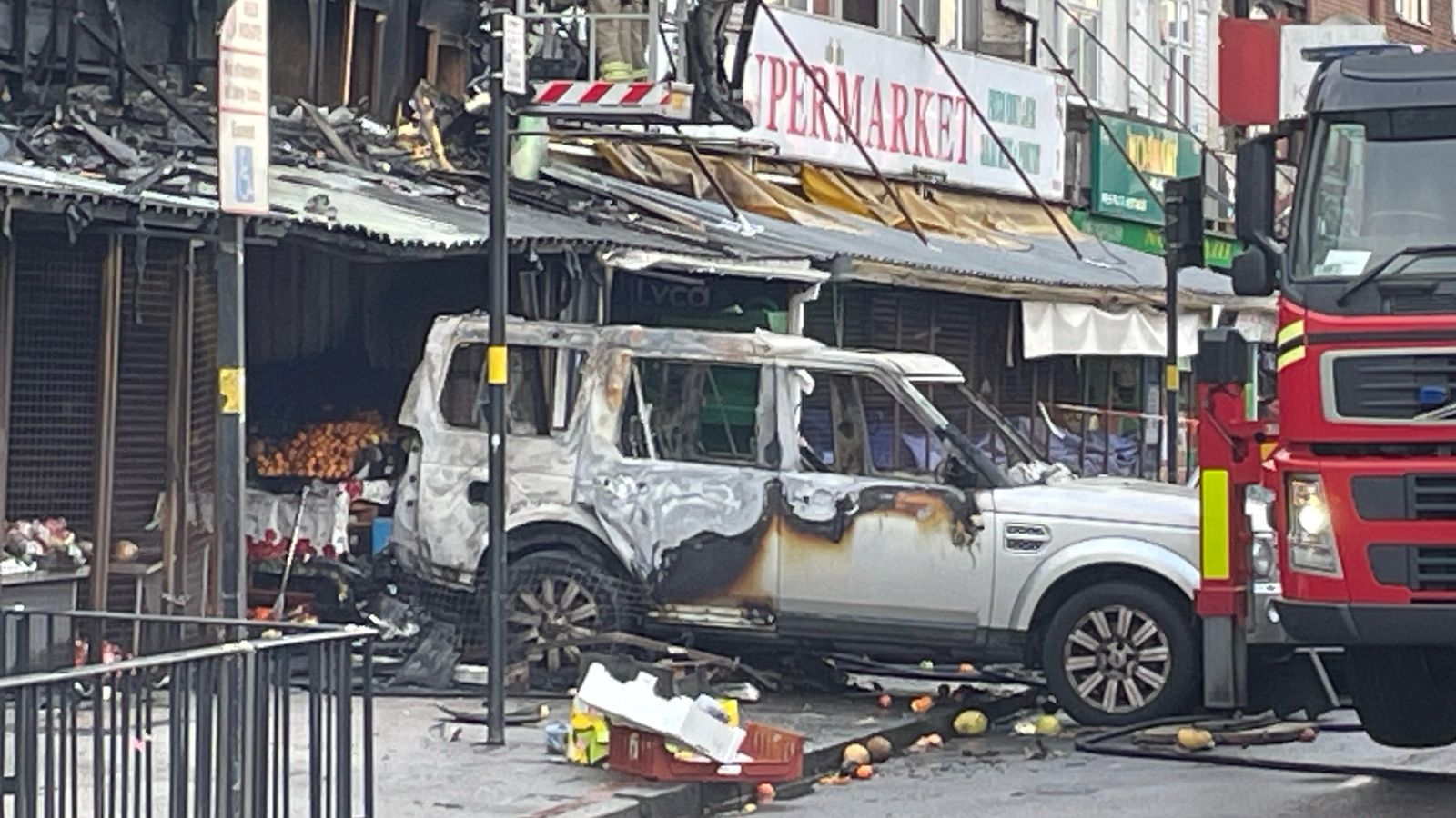 Flats catch fire after car rammed into Birmingham shop in suspected arson attack