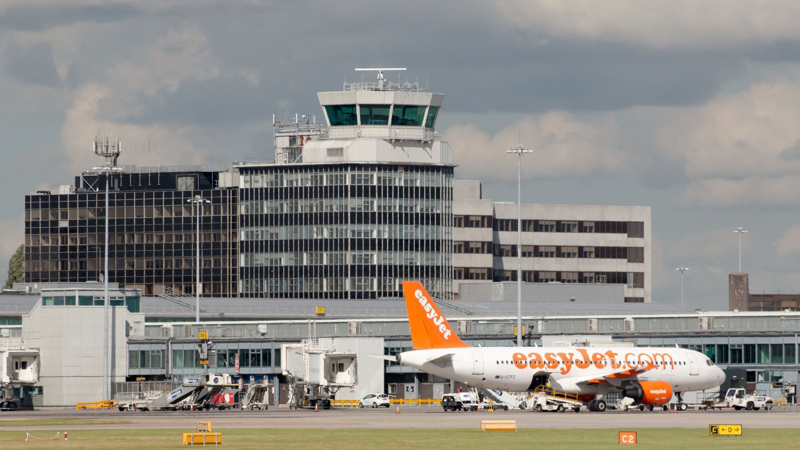 Two men charged over Manchester Airport incident in July