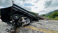 The car crushed under the truck after the crash near Teofilo Otoni. Pic: Belo Horizonte Military Fire Department/­Reuters