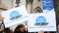 Demonstrators hold placards as they protest against Thames Water.
Pic Reuters