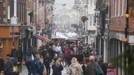 Last-minute shoppers on Christmas Eve make their way along the High Street in Winchester, Hampshire.
Pic: PA