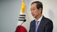 South Korean Prime Minister Han Duck-soo speaks during the joint statements in Seoul, South Korea, Sunday, Dec. 8, 2024, after President Yoon Suk Yeol avoided an opposition-led attempt to impeach him over his short-lived imposition of martial law. (AP Photo/Lee Jin-man)