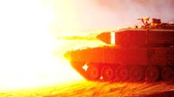 A tank fires during a NATO military exercise in Latvia. Pic: Reuters