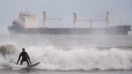 PABest A surfer catches a wave in the wind at Tynemouth Longsands on the North East coast of England. Snow, rain and wind warnings are in force and are expected to cause travel issues on New Year's Eve. Picture date: Tuesday December 31, 2024.

