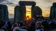 Handout photo issued by English Heritage of people gathering at Stonehenge in Wiltshire to mark the winter solstice, and to witness the sunrise after the longest night of the year.