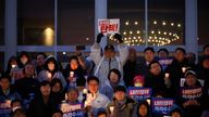 People hold candles and signs during a candlelight vigil to demand the resignation of South Korean President Yoon Suk Yeol.
Pic: Reuters