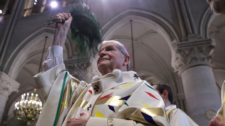 Paris Archbishop Laurent Ulrich gives the inaugural mass at Notre Dame Cathedral, hosting its first Mass since the catastrophic fire of 2019,, Sunday, Dec. 8, 2024 in Paris. (Christophe Petit Tesson, Pool via AP)