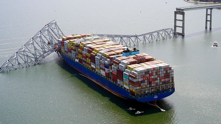 FILE - In this photo provided by the Maryland National Guard, the cargo ship Dali is stuck under part of the structure of the Francis Scott Key Bridge after the ship hit the bridge, Tuesday, March 26, 2024, in Baltimore. (Maryland National Guard via AP, File)