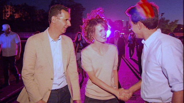 Dominic Wgahorn shakes hands with Asma al Assad