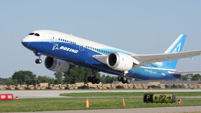 Boeing 787 Dreamliner in factory paint scheme taking off during EAA Airventure 2011