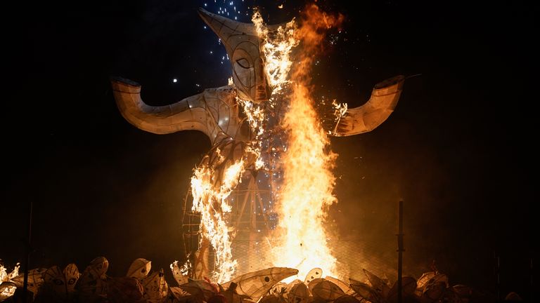 An effigy of the Wilderman is set on fire on the beach during the 'Burning the Clocks' parade of lanterns on Brighton beach in East Sussex as part of the Winter Solstice celebrations. Picture date: Wednesday December 21, 2022.