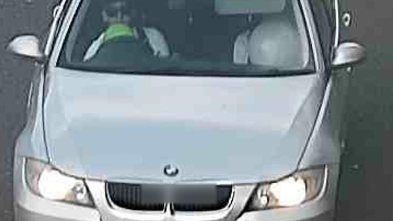 This image taken before the crash shows the driver and front passenger with balloons to their faces 