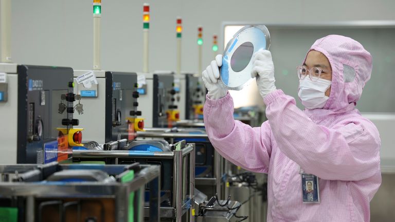 An employee works at a semiconductor manufacturer of automobile chips in Binzhou city in east China's Shandong province Wednesday, Dec. 25, 2024. U.S. has announced to raise the tariff on Chinese chips from 25% to 50% next year. Pic: FeatureChina via AP