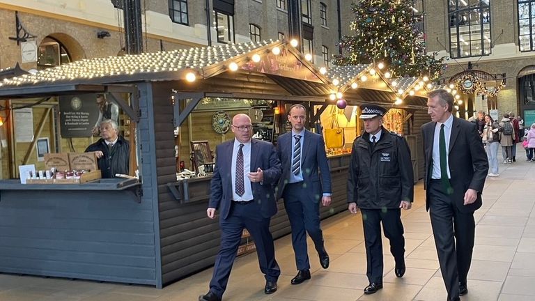 Security minister Dan Jarvis (far right) walks with Deputy Assistant Commissioner Savell (right)