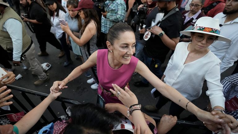 Mexico City Mayor Claudia Sheinbaum, right, greets supporters as she leaves a rally at the Revolution Monument in Mexico City, Thursday, June 15, 2023. Sheinbaum announced that she is resigning her post as Mexico City Mayor to enter the primary race for the country's 2024 presidential election. (AP Photo/Eduardo Verdugo)