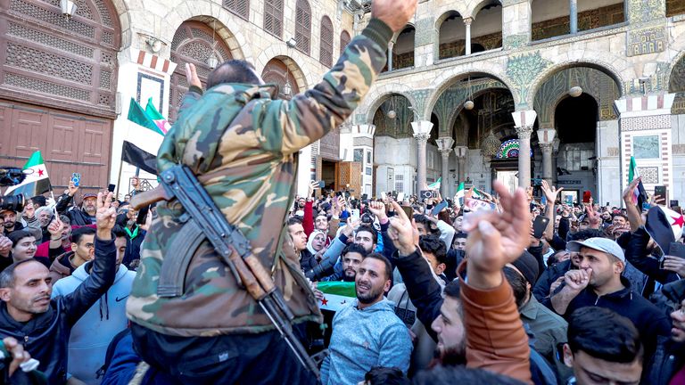 People react on the day of the first Friday prayers at the Umayyad Mosque, after fighters of the ruling Syrian body ousted Syria's Bashar al-Assad, in the Damascus old city, Syria, December 13, 2024. REUTERS/Amr Abdallah Dalsh.